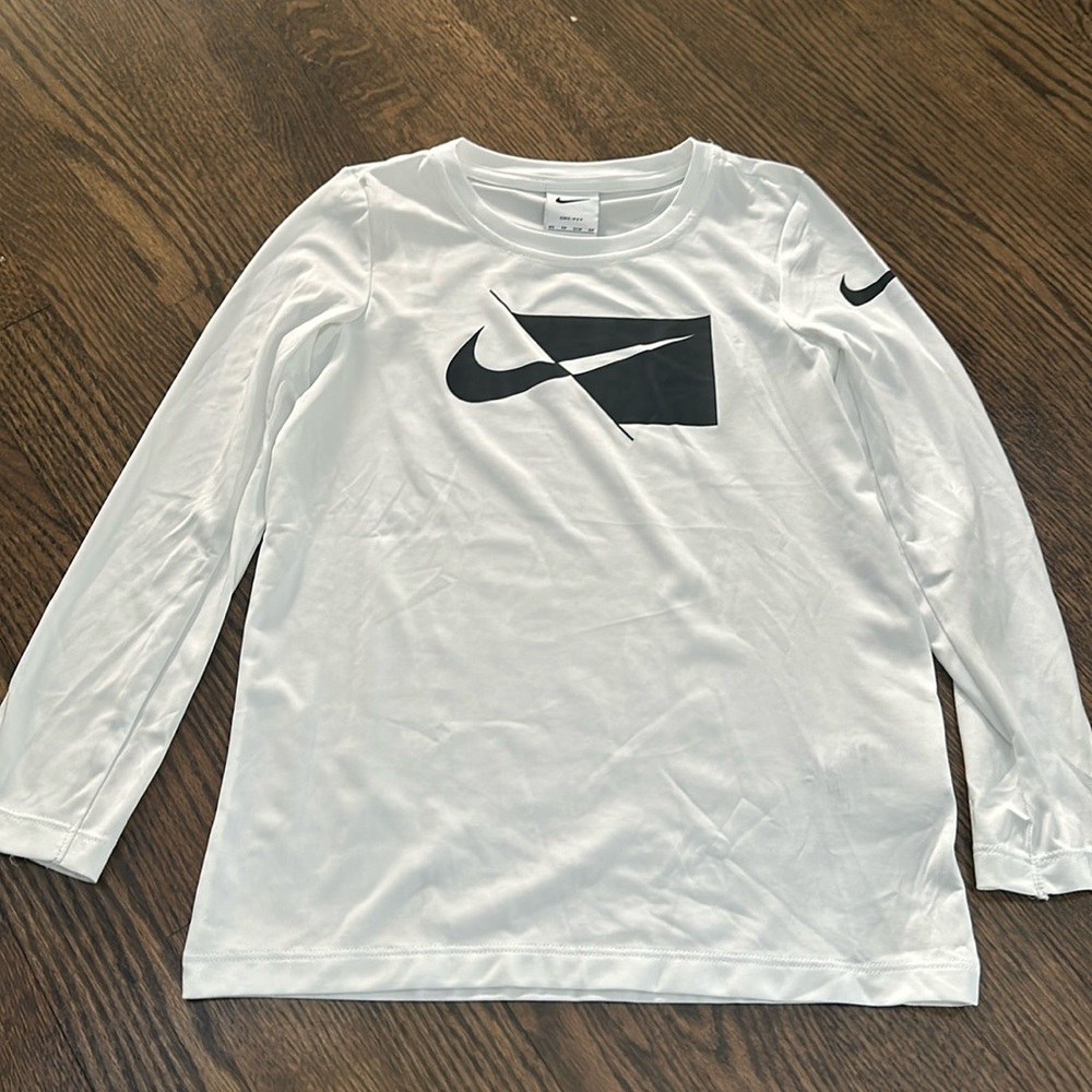 Nike boys white Dri-fit long sleeve tee shirt.  Barely worn and good condition.